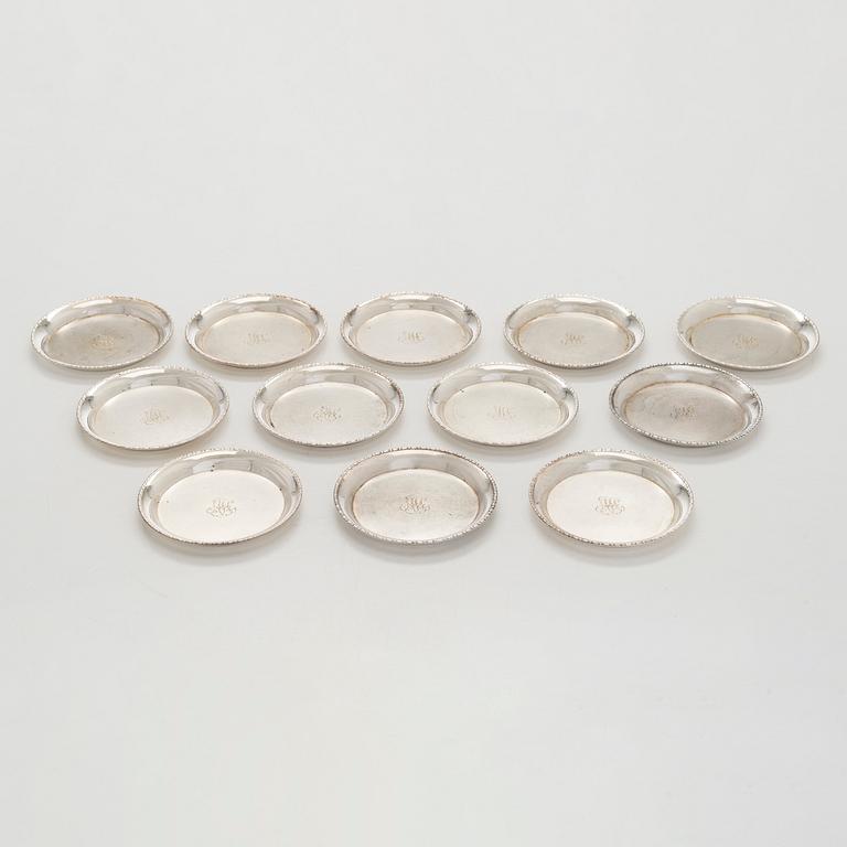 A 12-piece set of silver glass coasters, Kultakeskus, Hämeenlinna 1952. In original fitted case.