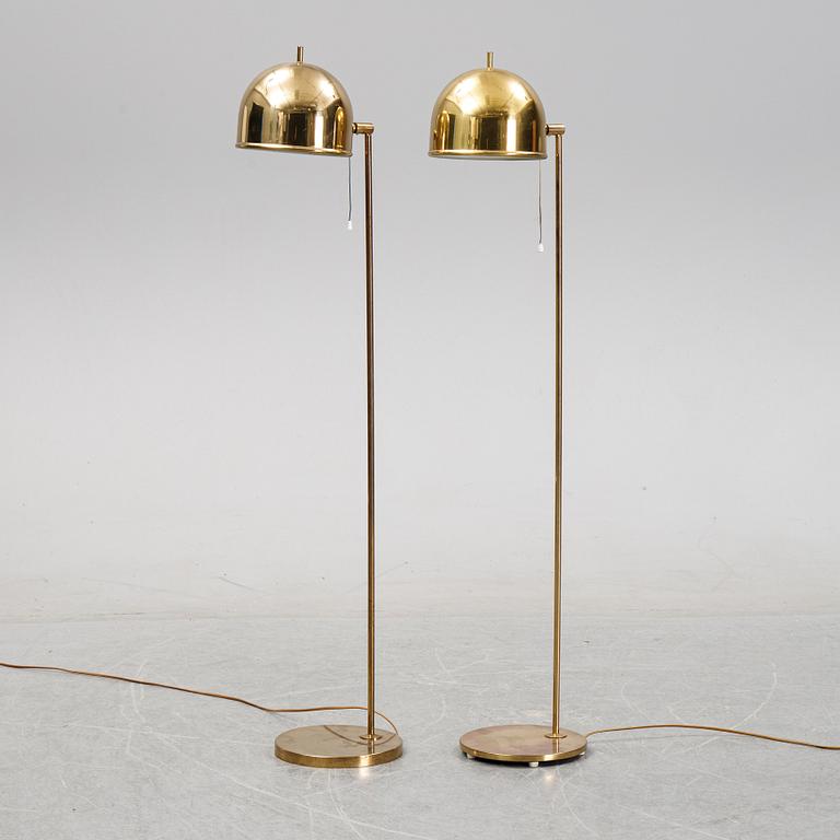 Eje Ahlgren, a pair of model G-075 brass floor lights, Bergboms, 1960's/1970's.