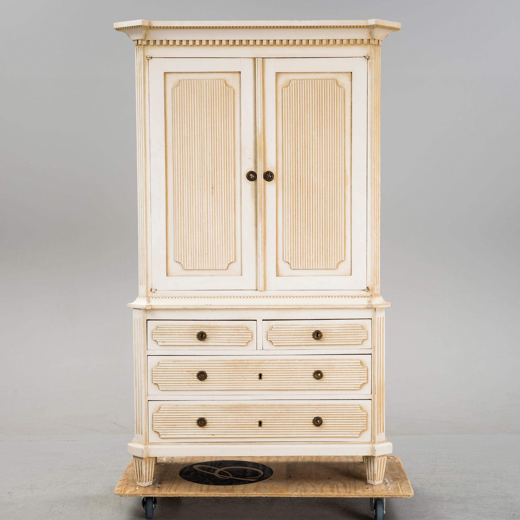 A gustavian style cabinet, circa 1900.