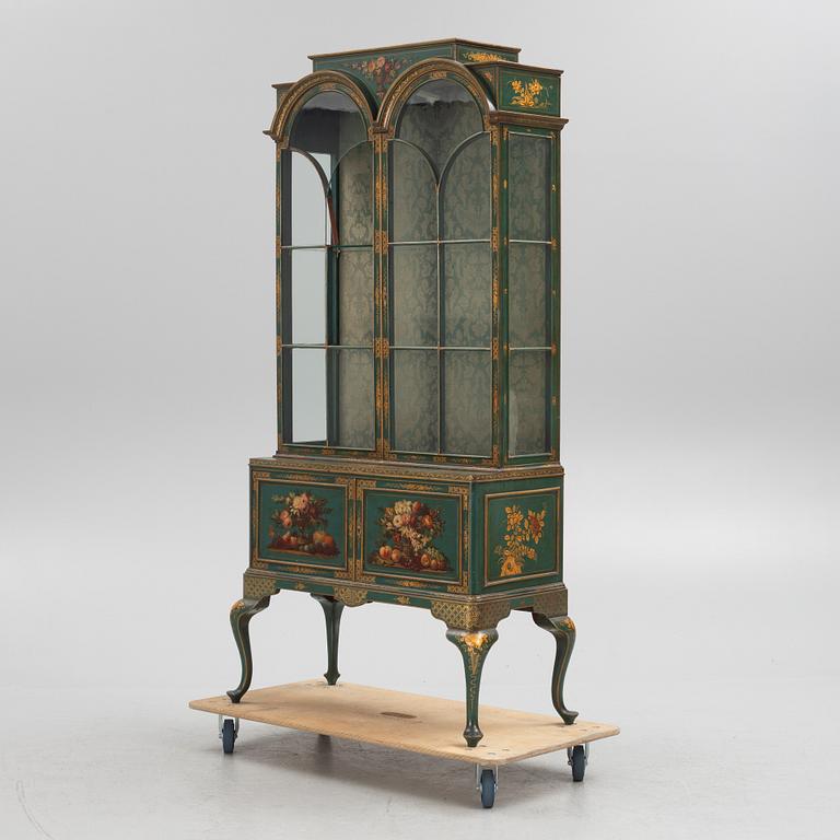 A display cabinet, England, early 20th Century.