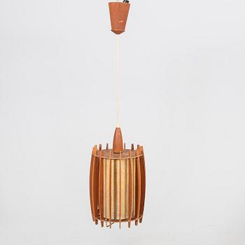 A mid 1900s teak ceiling pendant.