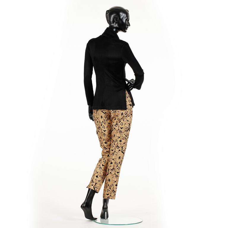 OZBEK, a polo-neck sweater and trousers.