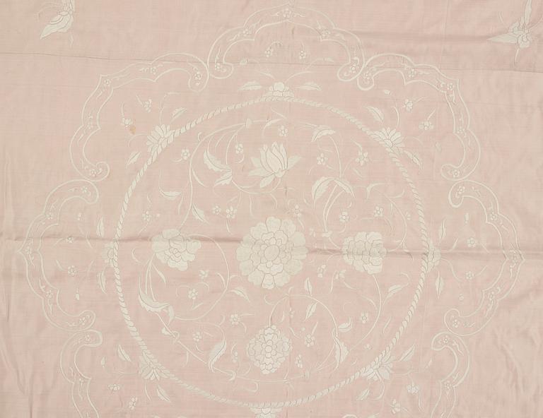 An embroidered silk bed spread, Qing dynasty, circa 1900.