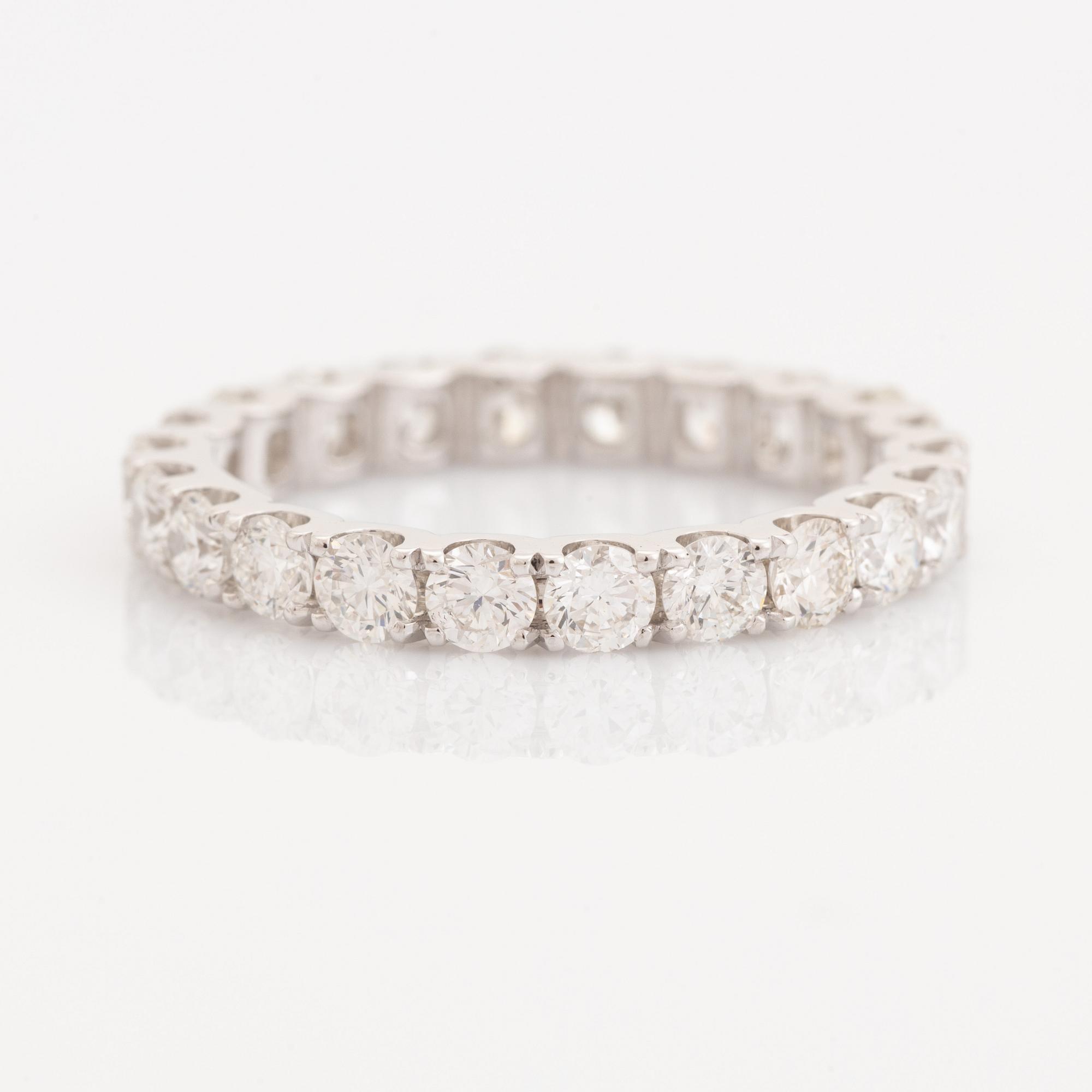Brilliant-cut diamond eternity ring.