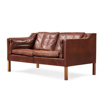 14. A Børge Mogensen two-seated dark brown leather sofa, Fredericia Stolefabrik, Denmark.