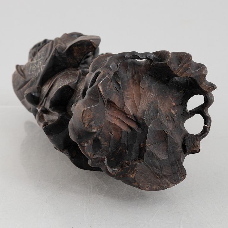 A Chinese wooden figure of 'Shoulao' with silver inlays, 20th century.