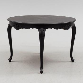 A mid 20th century rococo style dining table.