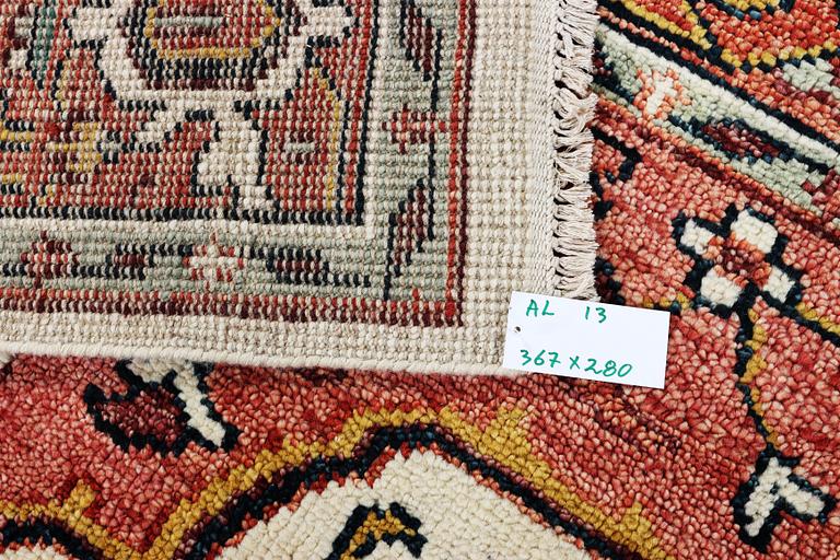 An oriental carpet with Mamluk design, c. 367 x 280 cm.