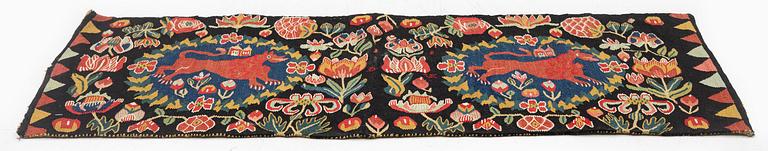 A cushion, 'Red Lion' (Rött Lejon), tapestry weave, c. 102 x 46cm, southwestern Scania, first part of the 19th century.