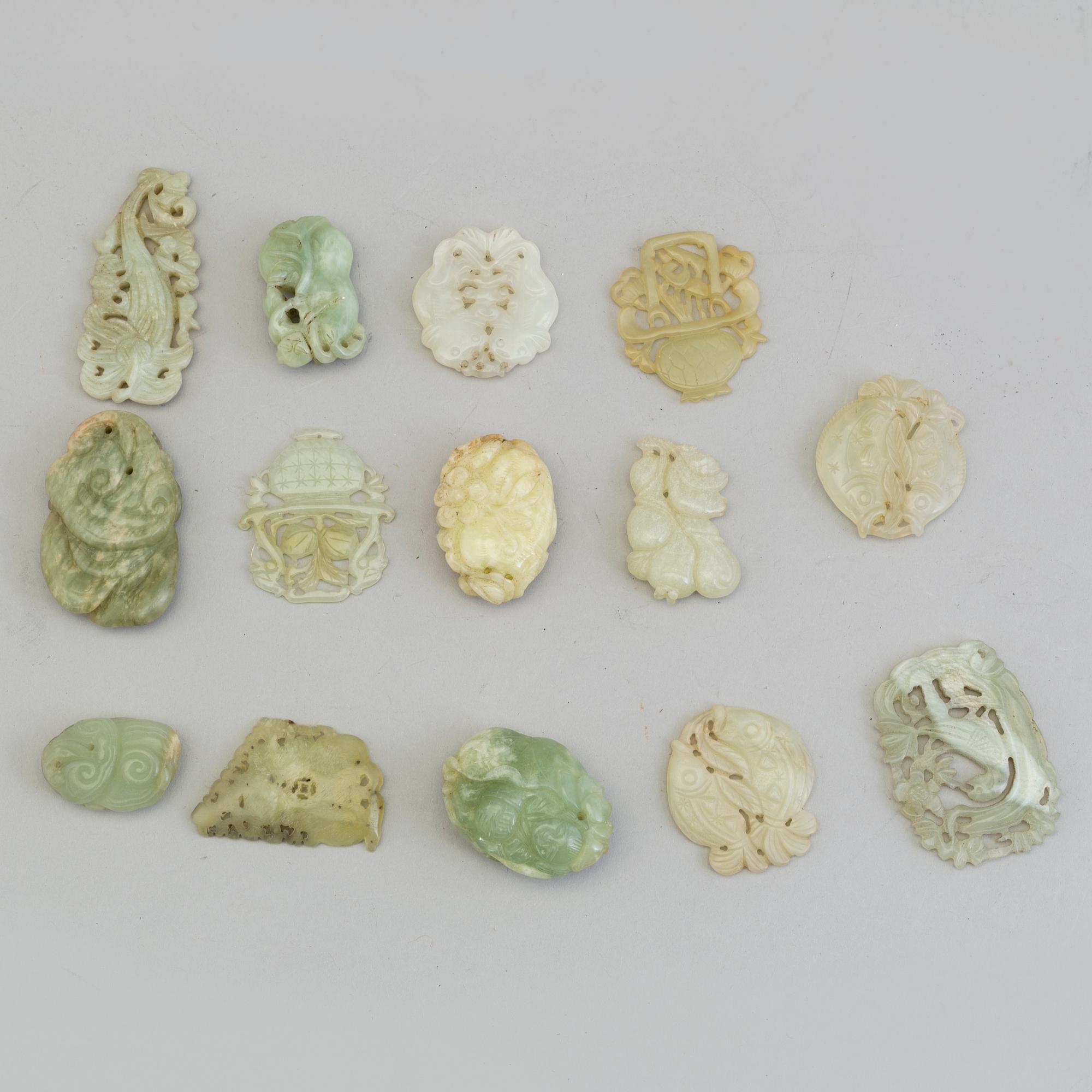 A set of 14 Chinese pendants/charms, some nephrite.