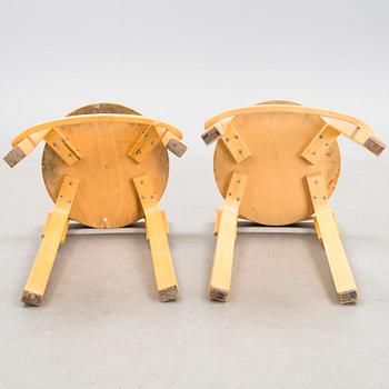 Two K65 bar stools, Artek, end of the 20th Century. Model designed in 1935.