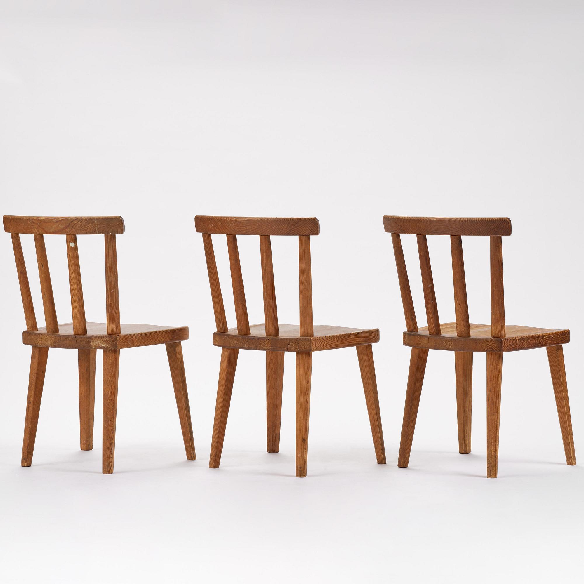 Axel Einar Hjorth, a set of three stained pine "Utö" chairs, Nordiska Kompaniet, Sweden, 1930s.