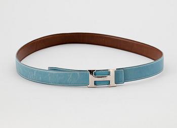 A light blue leather belt by Hermès.