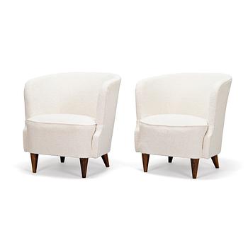 A pair of mid-20th-century armchairs.