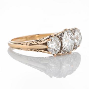 An 18K gold three stone ring with old-cut diamonds with a total weight of ca 3 cts.