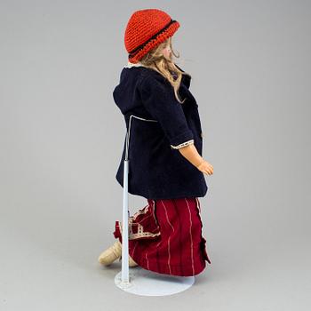 An Armand Marseille 3200 DEP Made in Germany bisque head doll.
