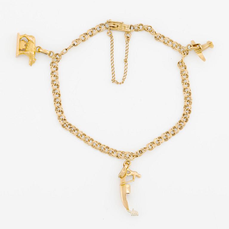 Bracelet 18K gold with charms.