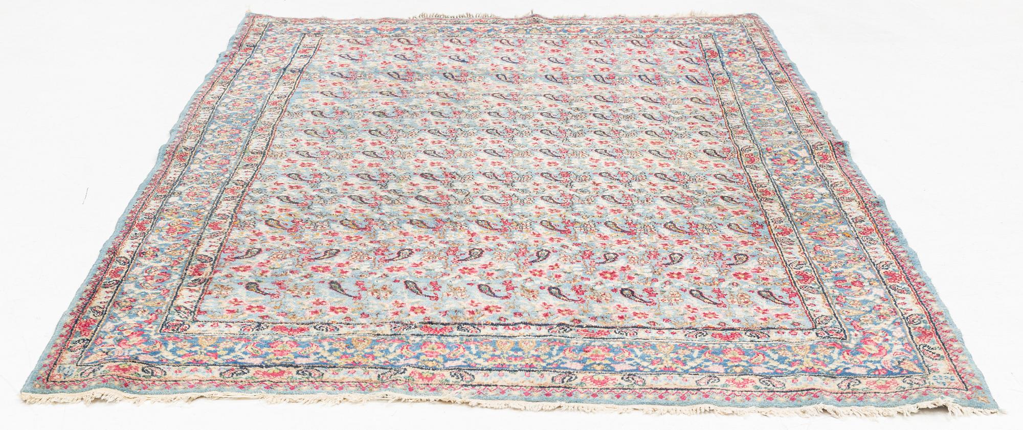 A Persian rug, c. 220 x 140 cm.