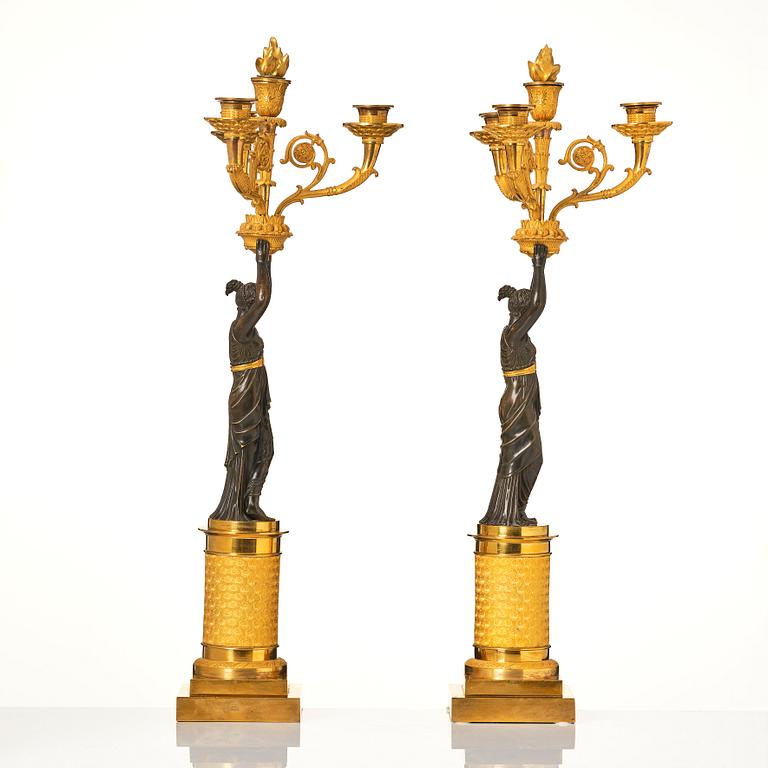 A pair of French Empire four-light candelabra, attributed to Francois Rabiat (bronze maker in Paris 1756-1815).