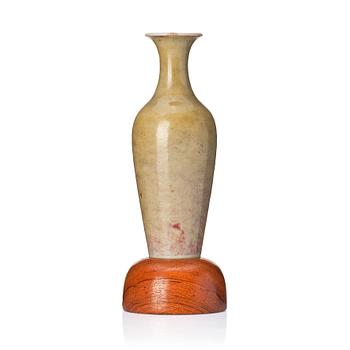 A pale celadon 'peachbloom' glazed vase, Qing dynasty with Kangxi six character mark.