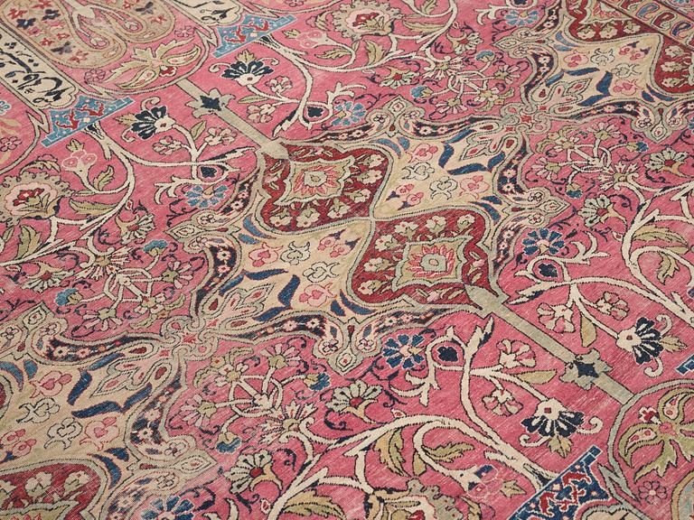 A CARPET, an antique Kerman Laver, ca 363 x 301 cm.