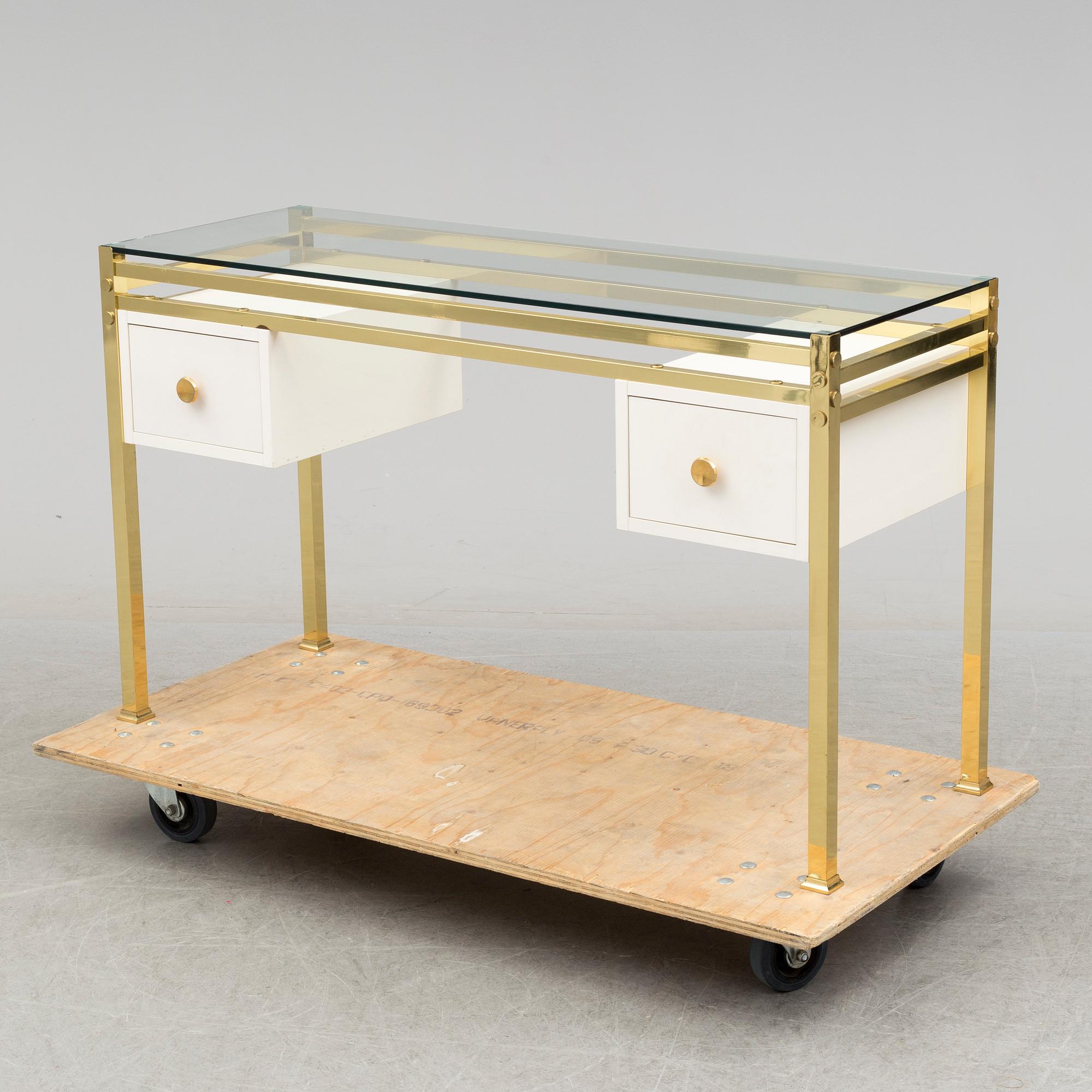 A 1980's dressing table with glasstop.