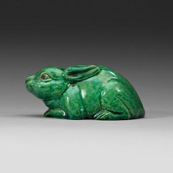 A green glazed figurine, Qing dynasty (1644-1912).