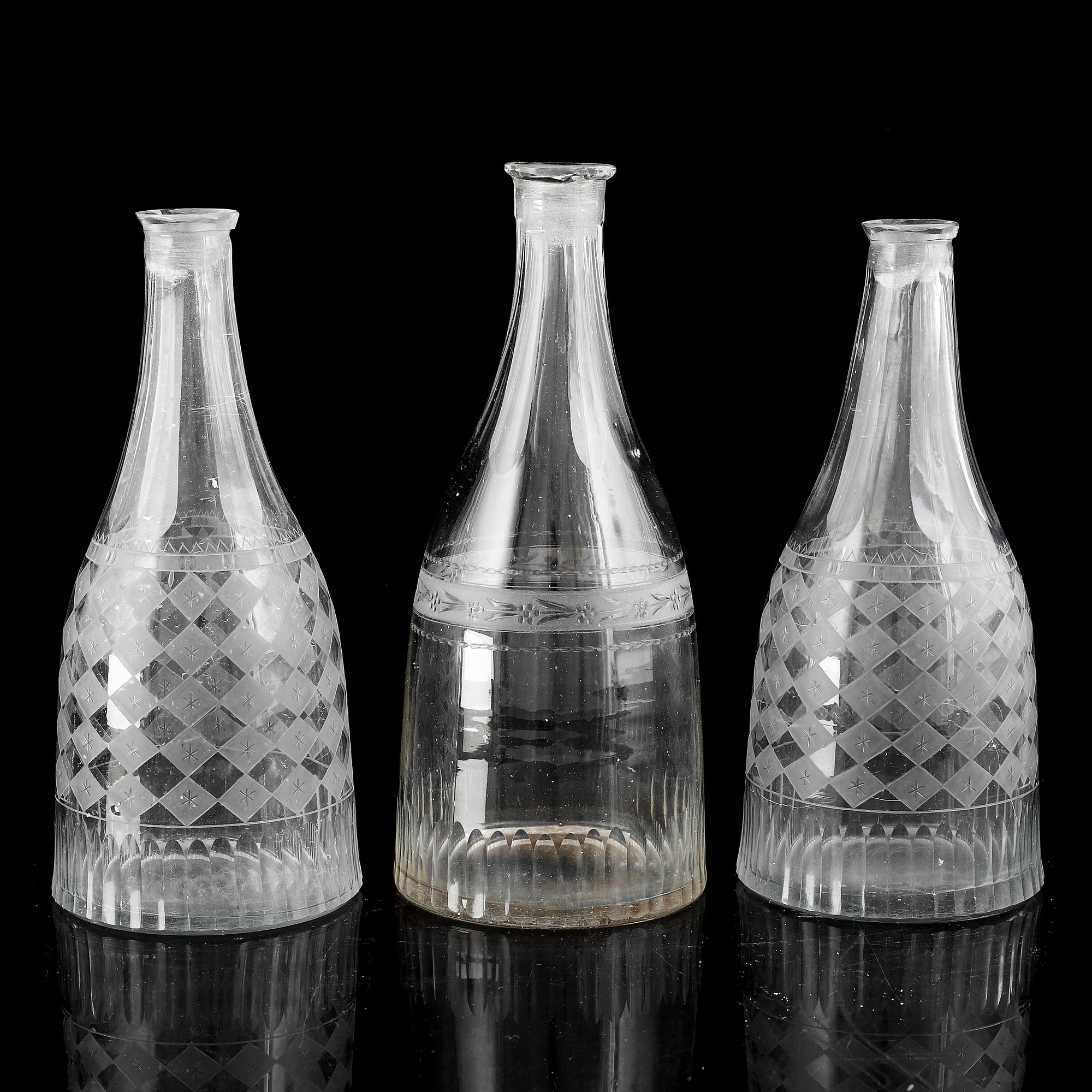 A set of three (2+1) bottles, 19th Century.