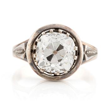 510. A 14K gold and silver ring with an old-cut diamond.