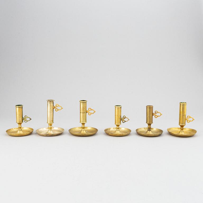 A set of six 19th-century brass candlesticks.