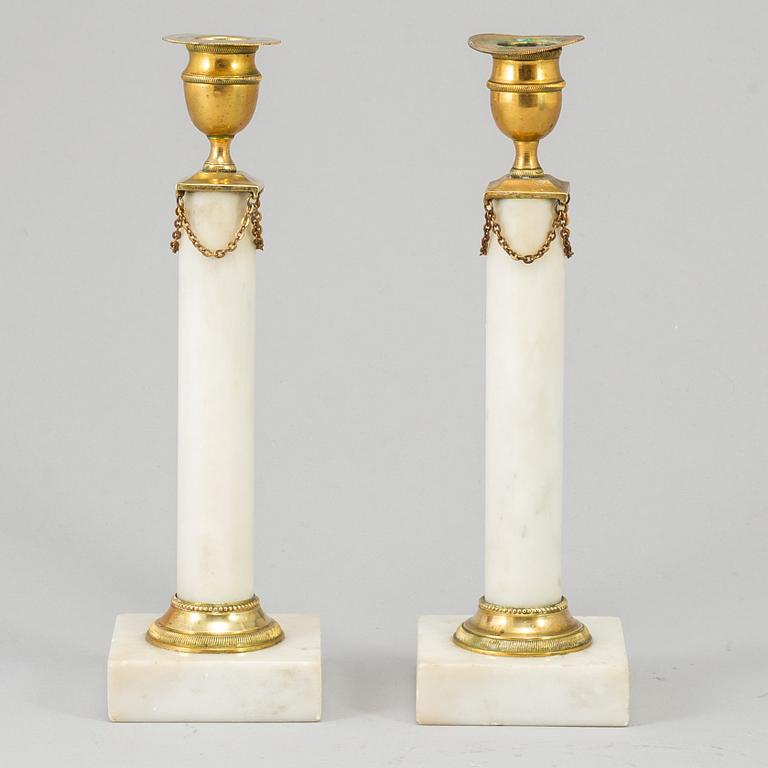 A pair of Gustavians style marble candlesticks, 20th Century.