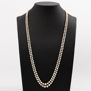 Cultured pearl necklace, double-strand with graduated pearls, Stigbert 18K gold clasp set with a cabochon-cut amethyst.