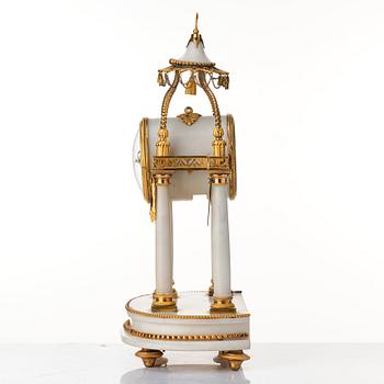 A Louis XVI mantel clock.