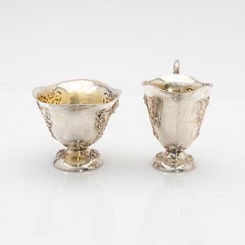 Cream jug and sugar bowl, silver, early 20th century.