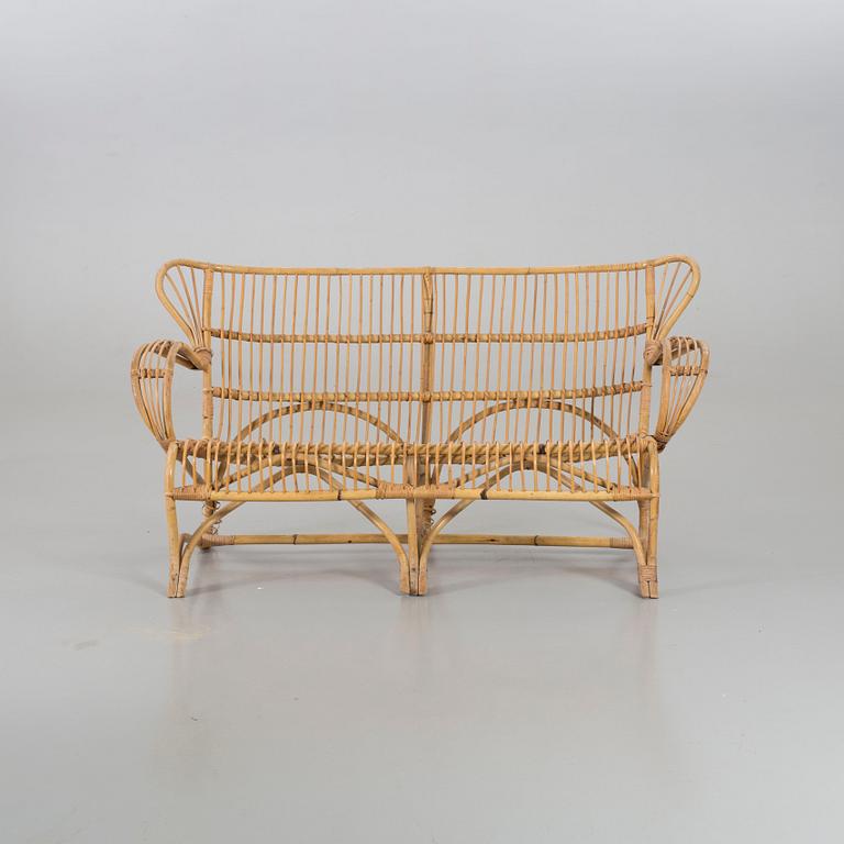 A mid 20th century ratten couch.