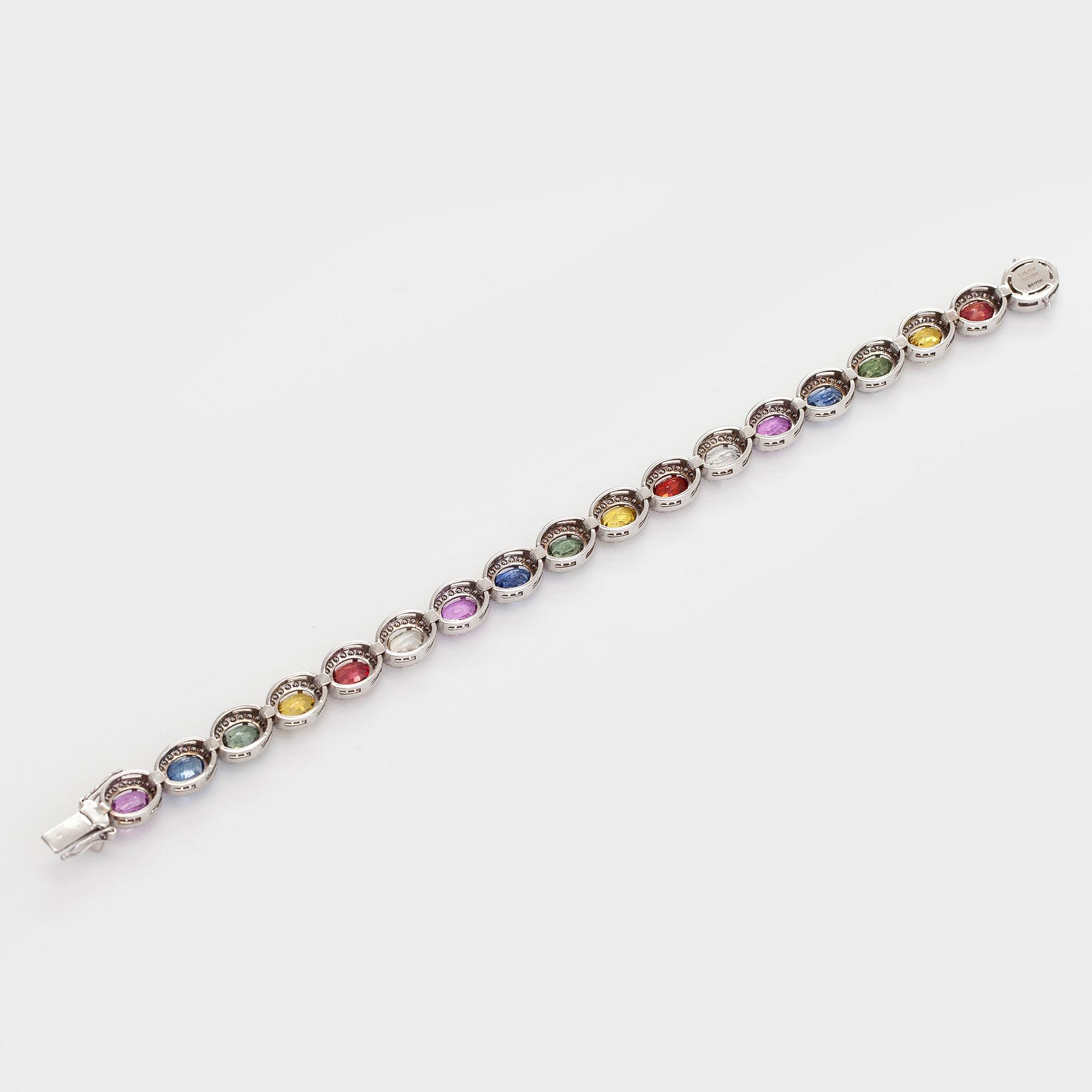 A multi-colour sapphire and diamond bracelet in 14K whitegold.