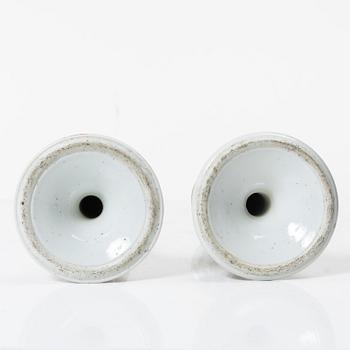 A pair of famille rose Canton candle sticks, Qing dynasty, 19th century.