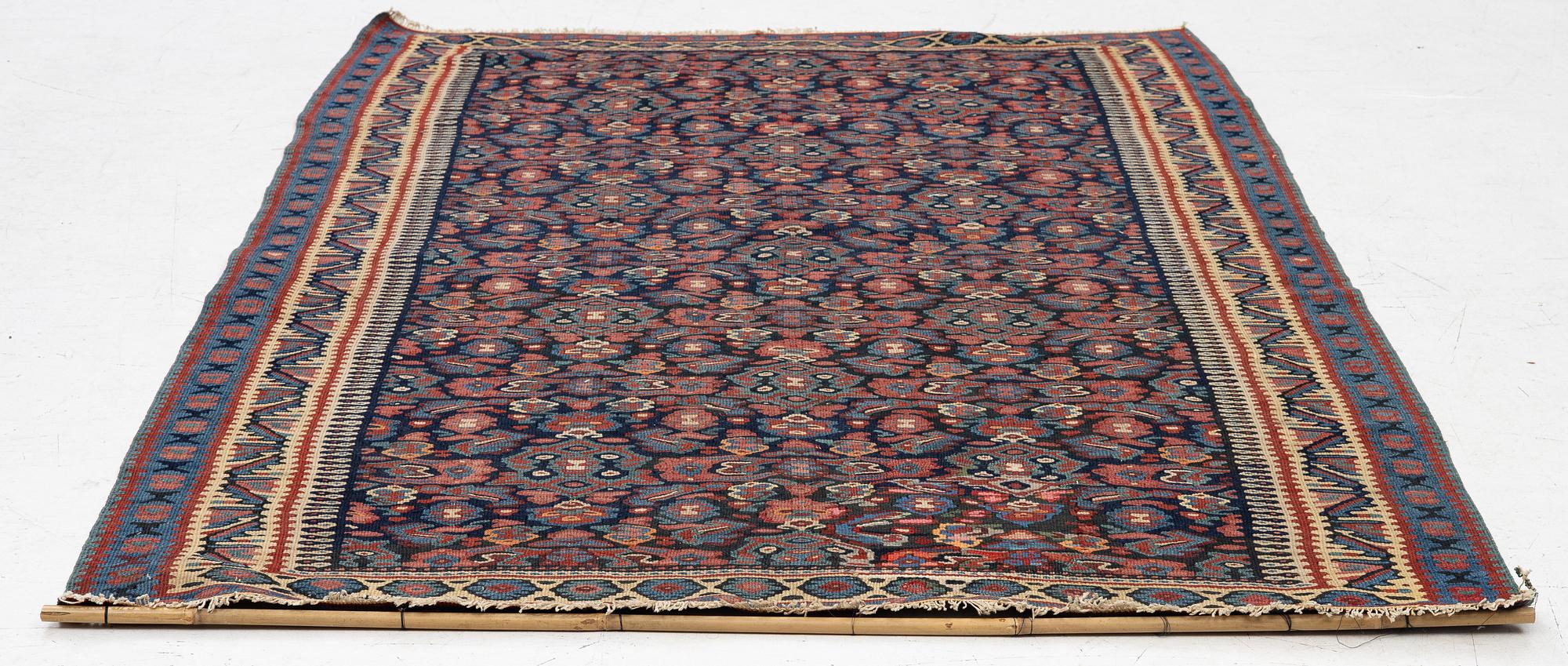 An antique Senneh kilim, West Persia, c. 149 x 11 cm.