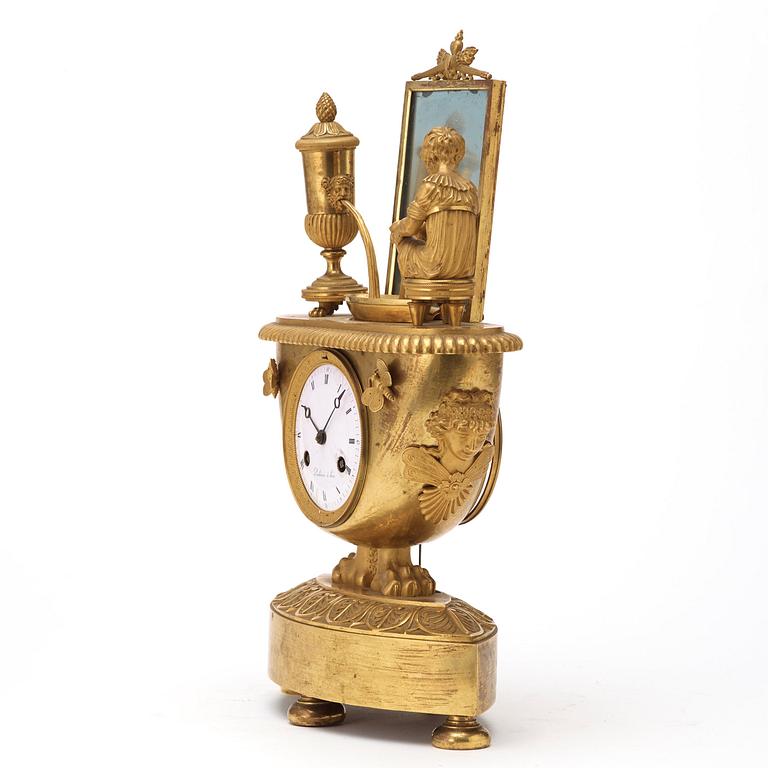 A French Empire early 19th century gilt bronze mantel clock.