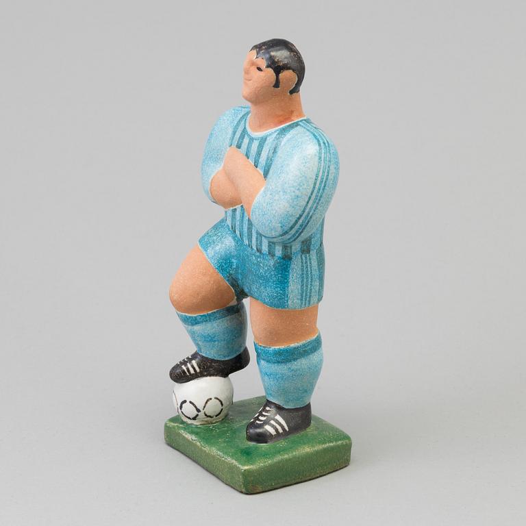 A Lisa Larson stoneware figure of a football player, Gustavsberg.