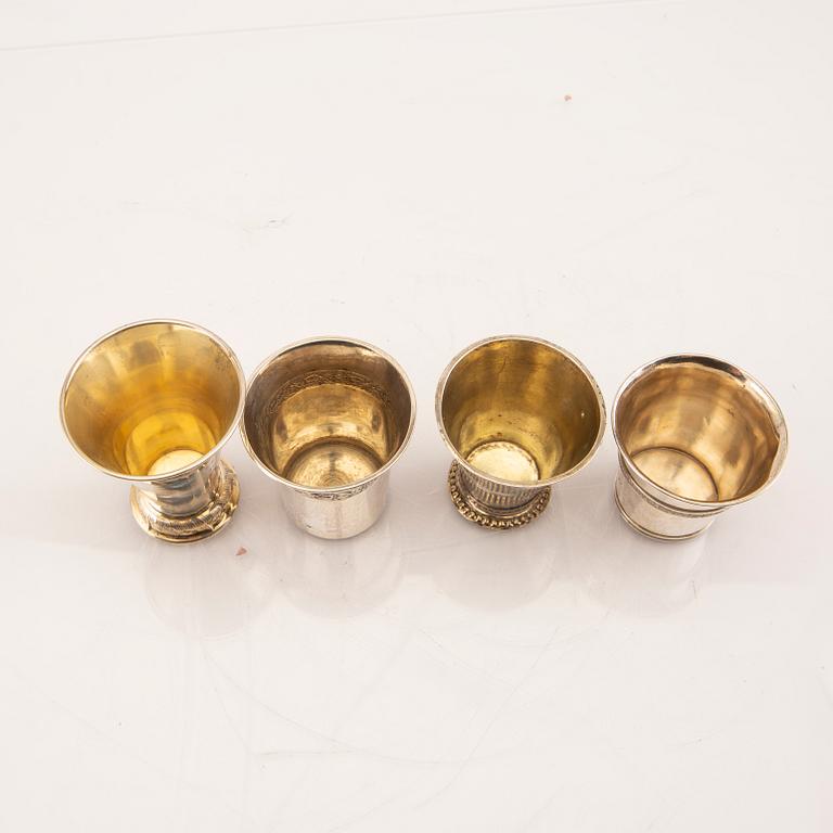 A set of four 19th/20th century silver beakers weight 207 grams.