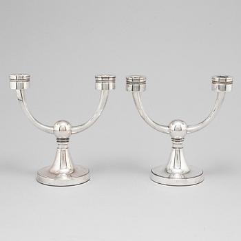 A pair of silver candelabra from MGAB, Uppsala, 1969-71.