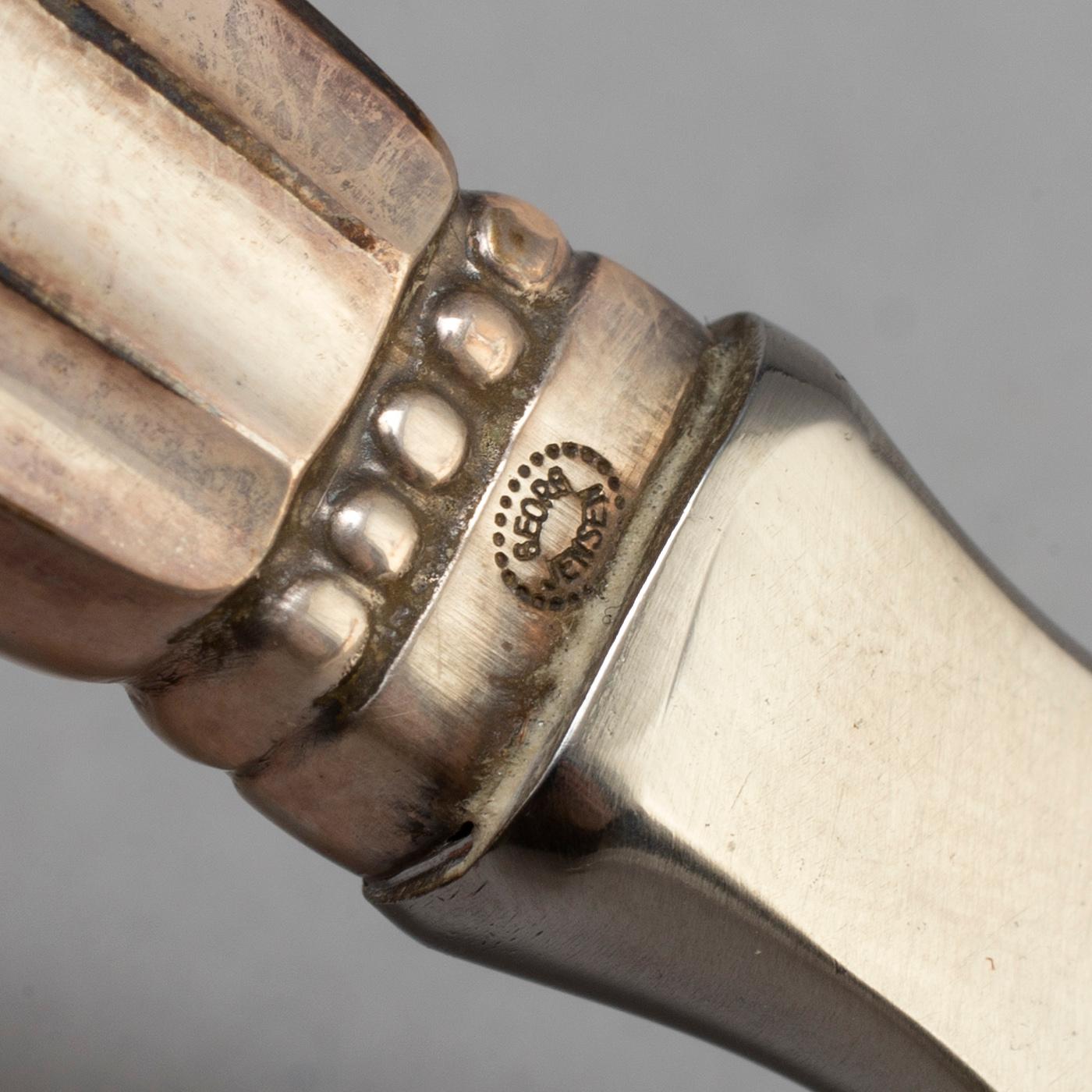 A Danish 20th century set of three Georg Jensen silver openers.