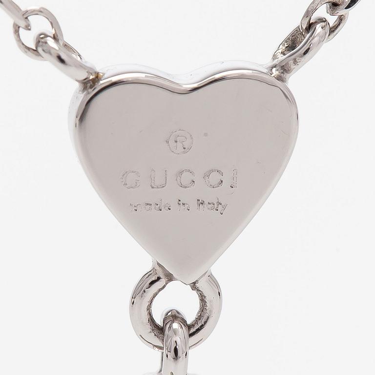 Gucci, an 18K white gold necklace with diamonds.