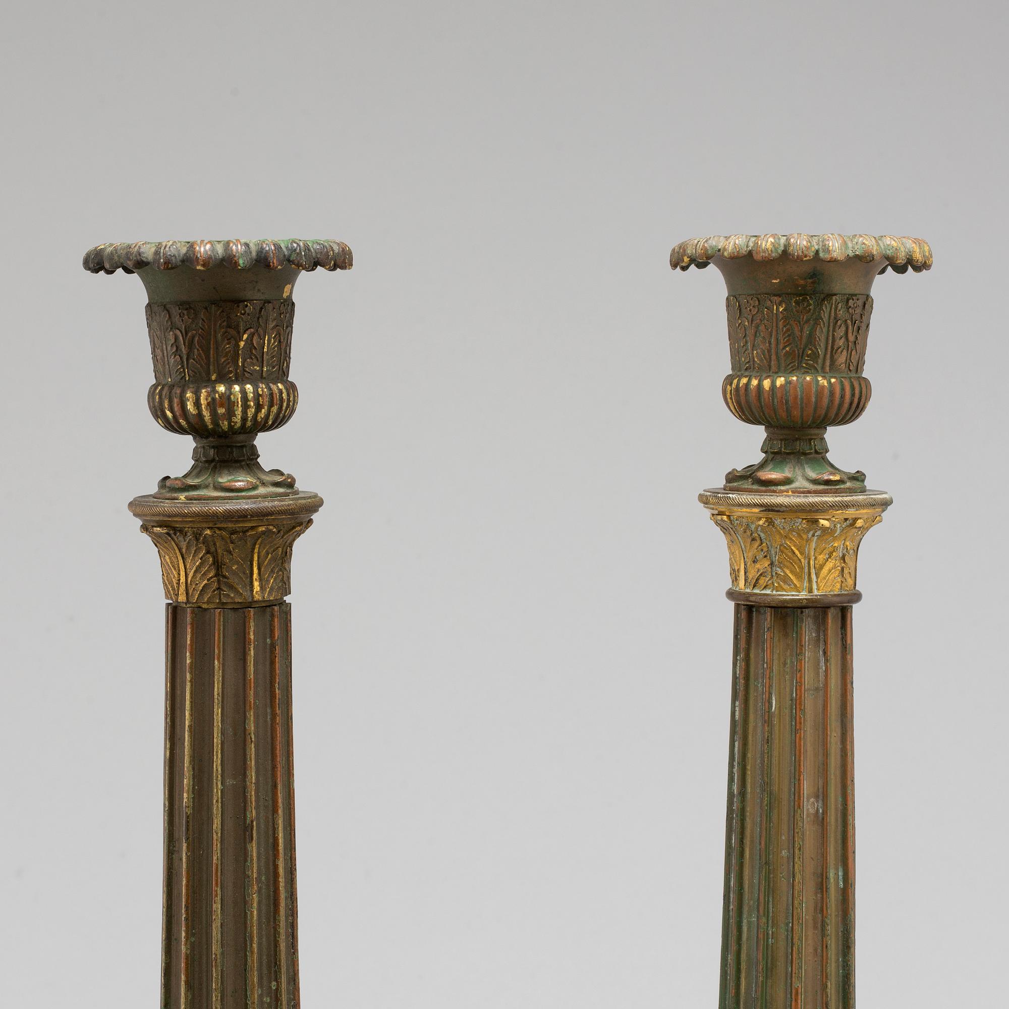 A pair of bronze gustavian candlesticks, late 18th century.