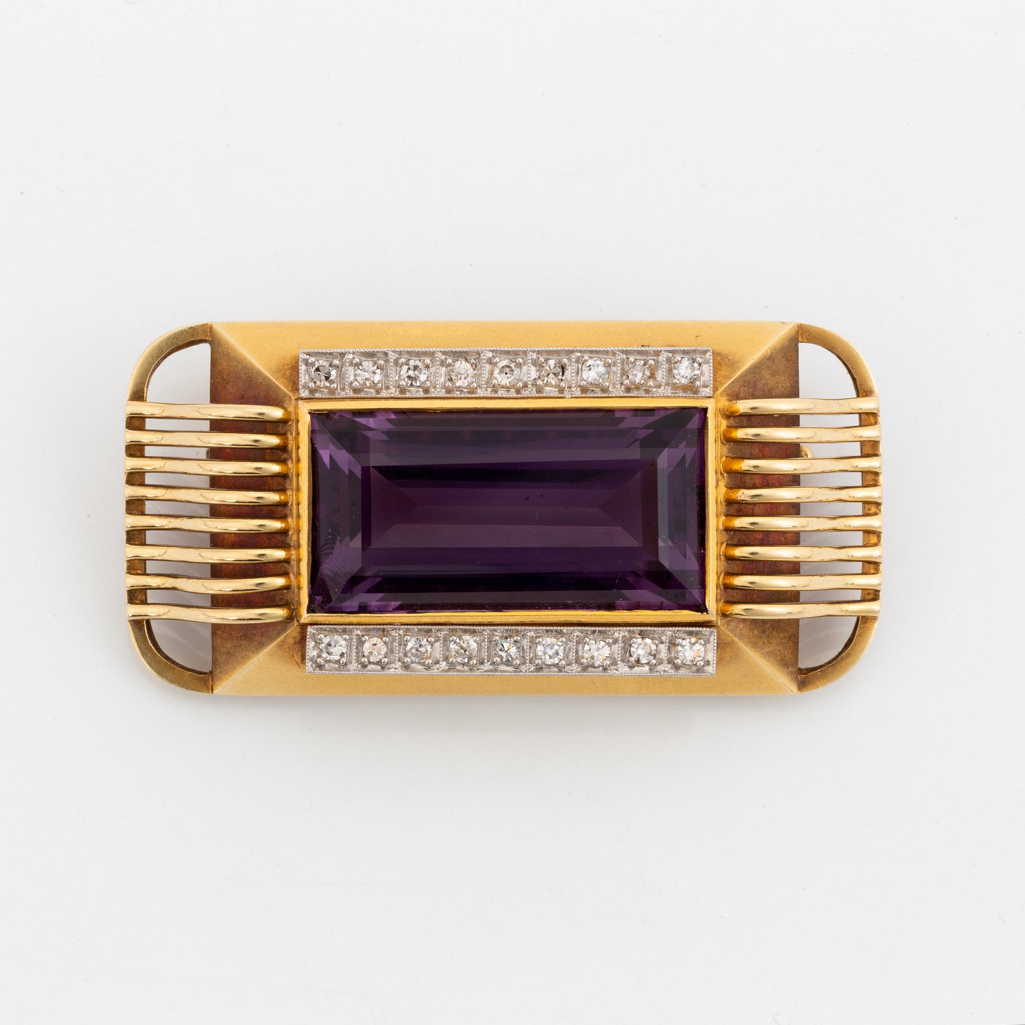 A 14K gold brooch set with a faceted amethyst and eight-cut diamonds.