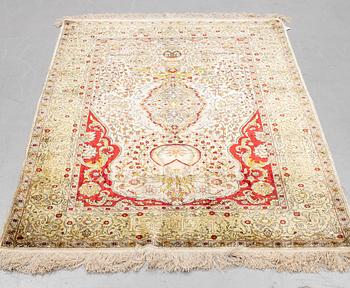A rug, Old silk Hereke, ca 178 x 119 cm.