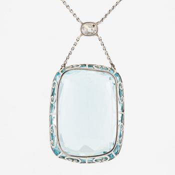 A platinum necklace with a faceted aquamarine and an oval old-cut diamond.