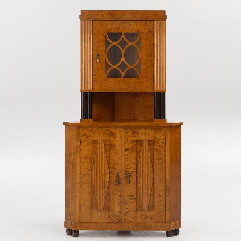 A Swedish Grace corner cabinet, 1920's/30's.