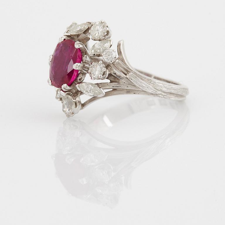 A WA Bolin ring set with a faceted pink sapphire and round brilliant- and navette-cut diamonds.